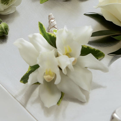 White Mini Cymbidium Boutonniere –  North Shore Florist, North Vancouver BC